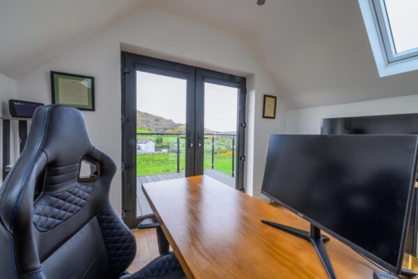 Vaulted ceilings with exposed timbers in Aghmakane home