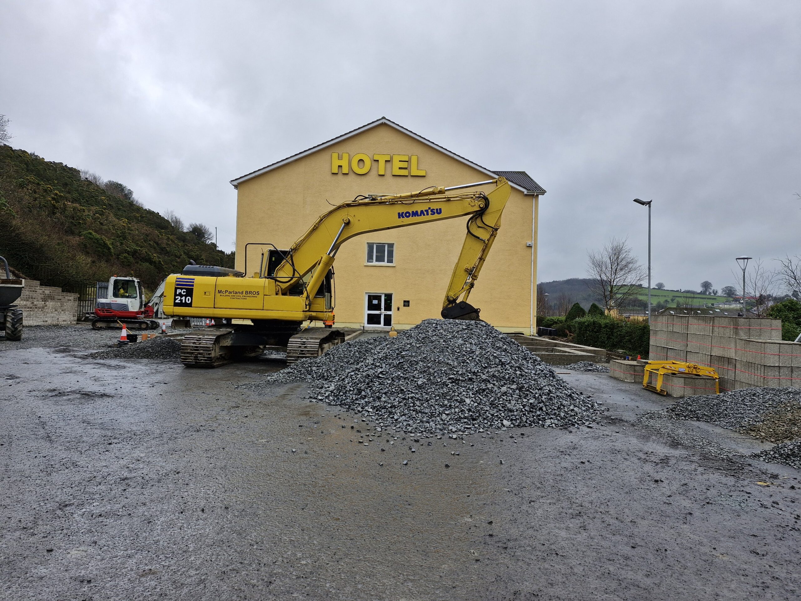 Civil engineers installing site drainage systems